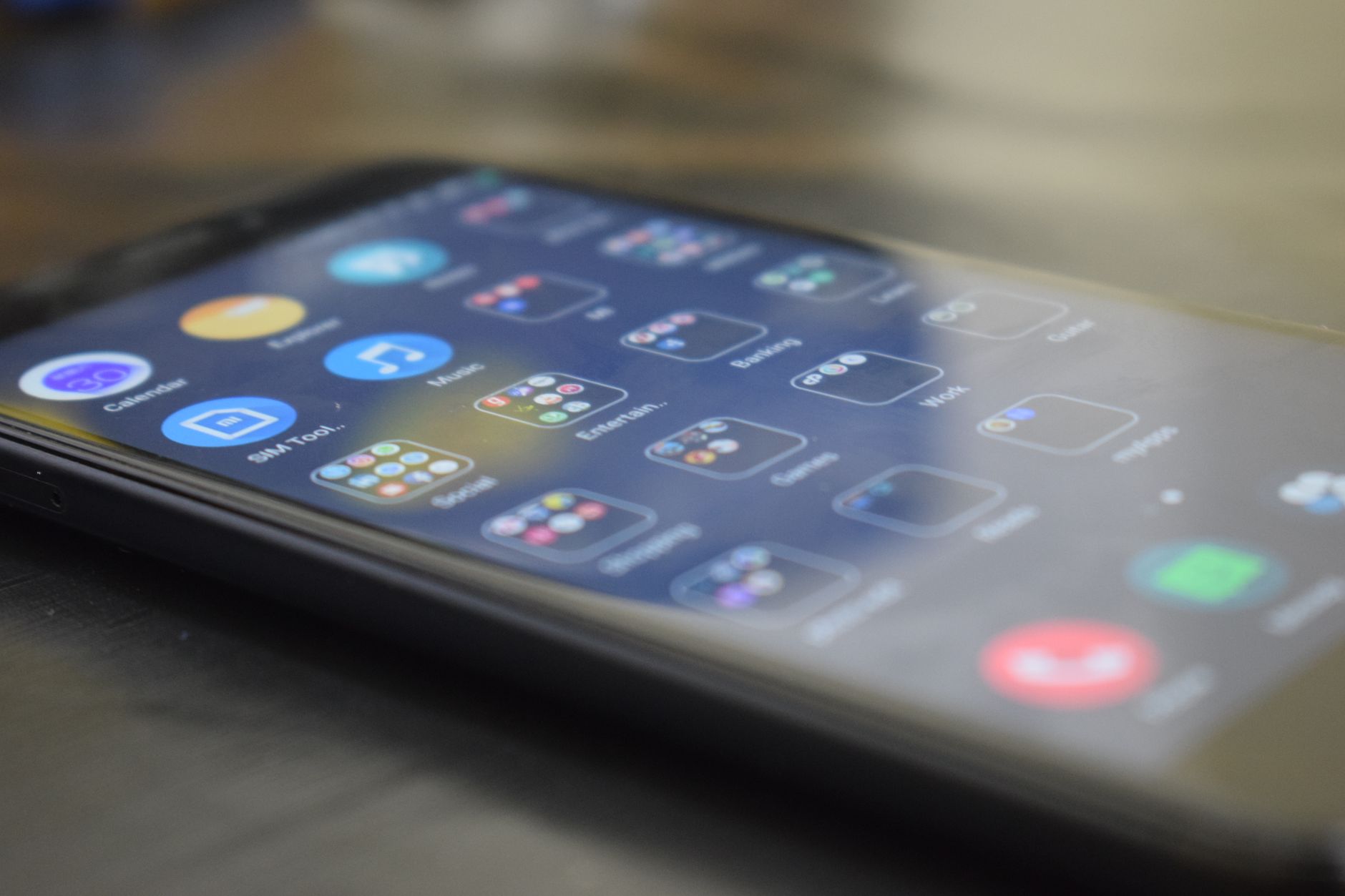 Close-up shot of a smartphone screen showing various app icons, indicating digital technology use. — Analyzing the Applicatio