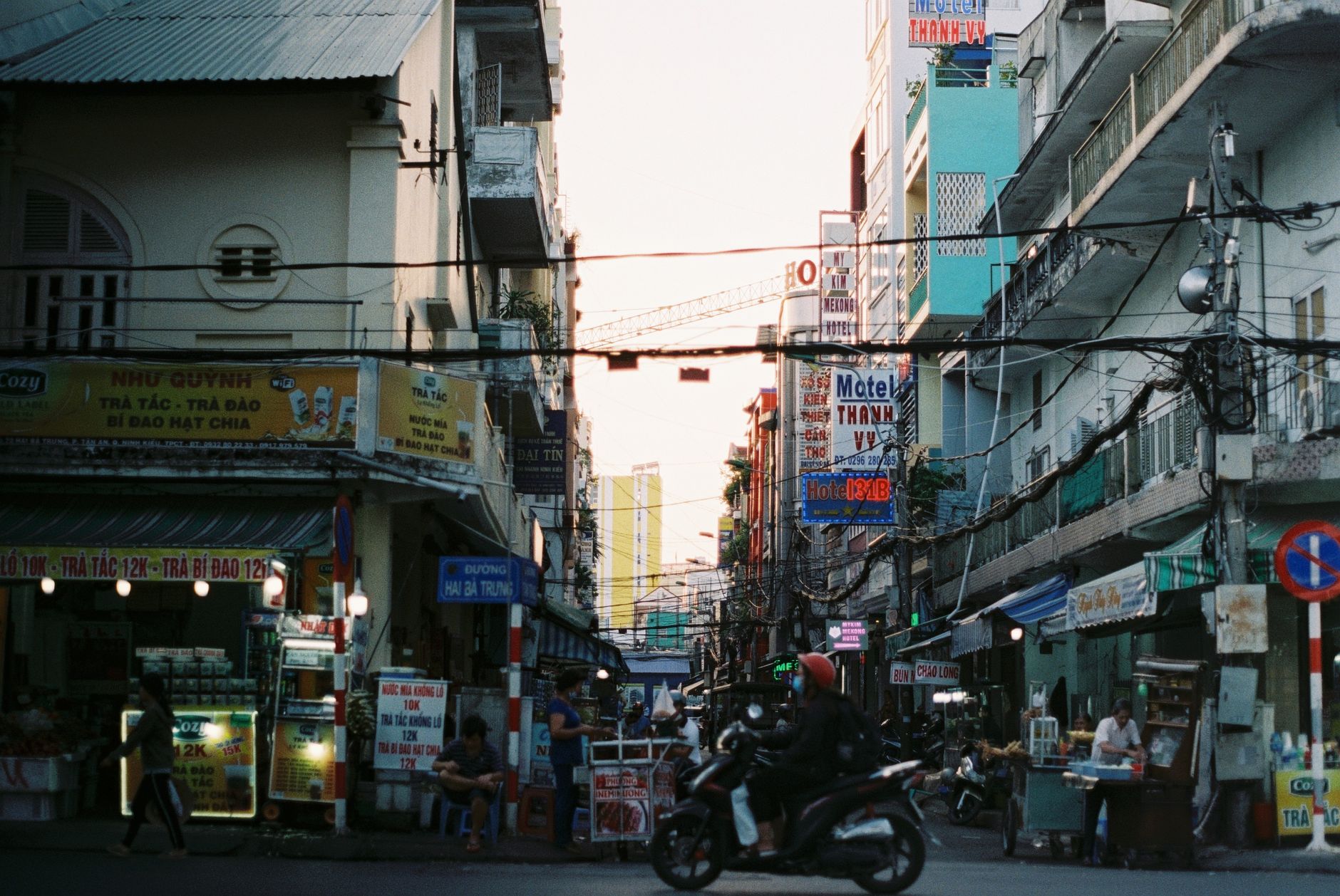 Colorful busy street scene in Cần Thơ, Vietnam with vibrant signs and people. — "Exploring the Role of HCG in Testosterone Re