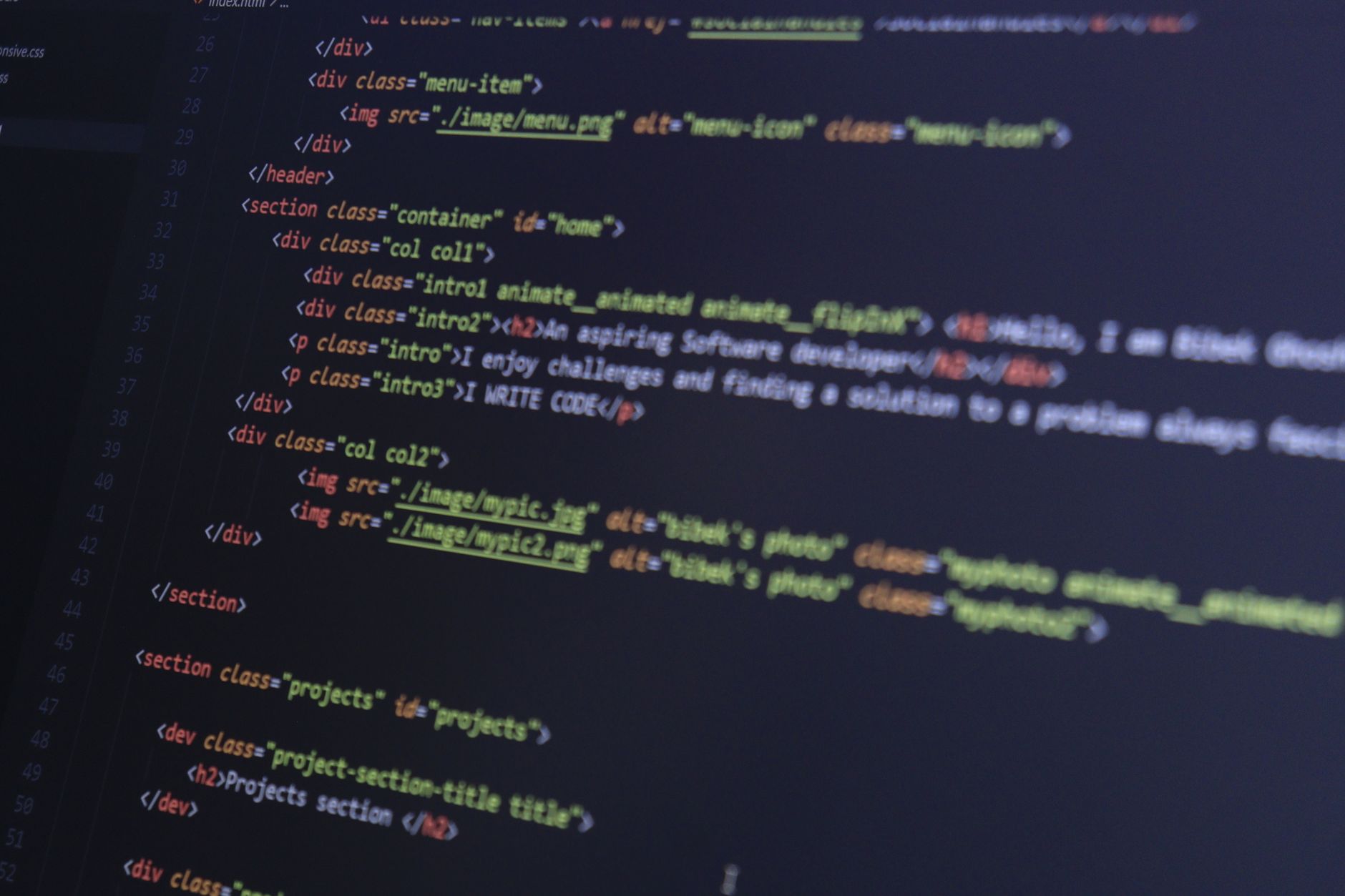 HTML and CSS code on a computer monitor, highlighting web development and programming. — Importance of Neon Indications for M