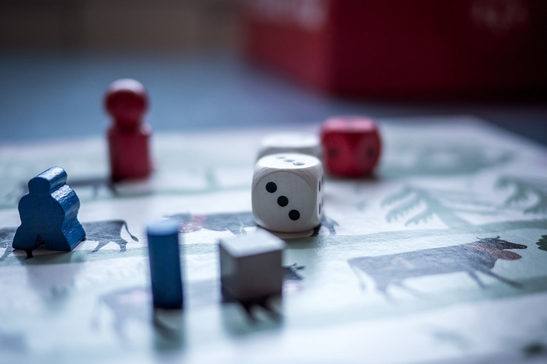 Close-up view of board game pieces and dice on a game board. Perfect for recreation and strategy themes. — Reach the Highest