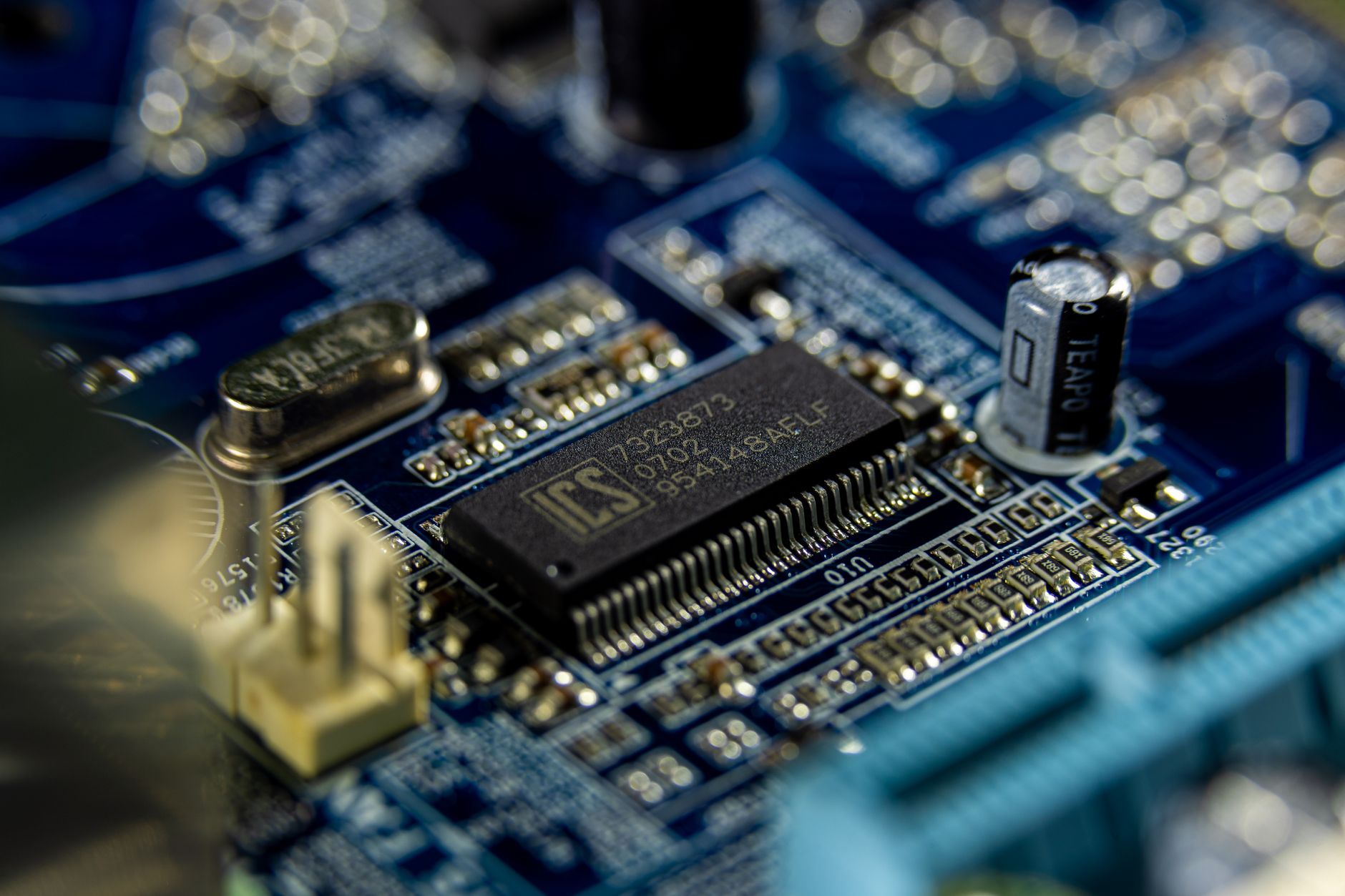 Detailed shot of a microprocessor on a blue motherboard showcasing electronic components. — What is Digital Mail?